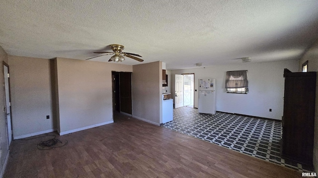 101 Diamond St, Mound City, IL 62963 - unfurnished living room with ceiling fan, wood finished floors, baseboards, and a textured ceiling
