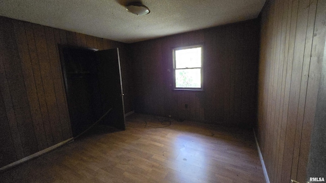 101 Diamond St, Mound City, IL 62963 - unfurnished bedroom featuring wood walls and wood finished floors