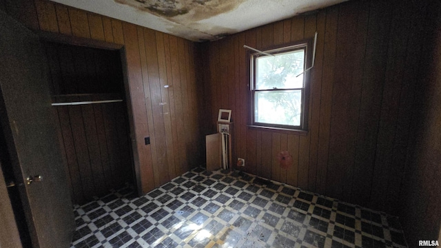 101 Diamond St, Mound City, IL 62963 - unfurnished bedroom with tile patterned floors and wood walls