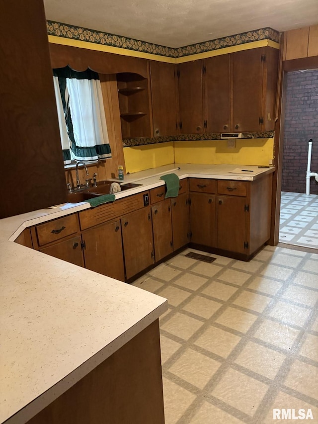 1606 W Faust St, Marion, IL 62959 - kitchen with light countertops, open shelves, light floors, and a sink
