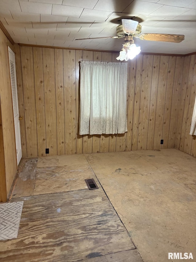 1606 W Faust St, Marion, IL 62959 - empty room featuring ceiling fan and wood walls