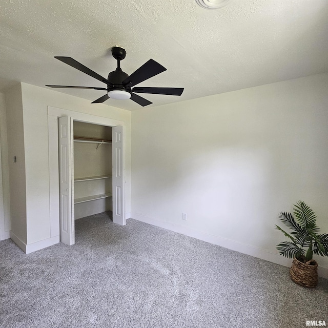 15074 N Mccauley Ln, Mount Vernon, IL 62864 - unfurnished bedroom featuring carpet, a closet, baseboards, and a textured ceiling