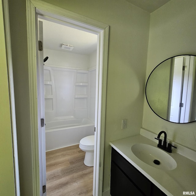 15074 N Mccauley Ln, Mount Vernon, IL 62864 - full bath featuring vanity, toilet, wood finished floors, and bathtub / shower combination
