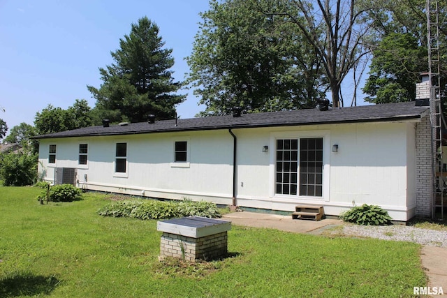15074 N Mccauley Ln, Mount Vernon, IL 62864 - back of house featuring a lawn and a chimney