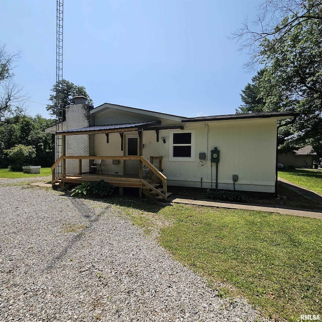 15074 N Mccauley Ln, Mount Vernon, IL 62864 - back of property featuring a chimney, a wooden deck, and a yard