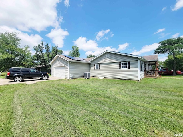 100 Stable Dr, Carterville, IL 62918 - view of home's exterior with cooling unit, a garage, driveway, and a yard