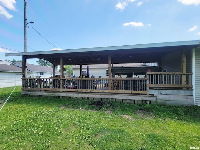 100 Stable Dr, Carterville, IL 62918 - deck featuring a lawn