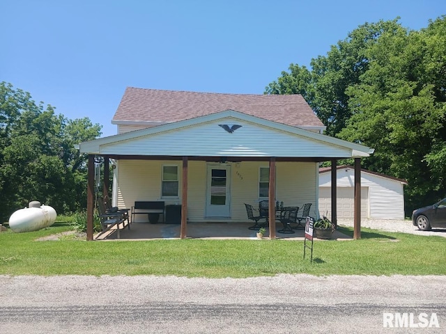 2623 Kk Rd, Waterloo, IL 62298 - view of front facade featuring a front lawn, an outdoor structure, and a patio