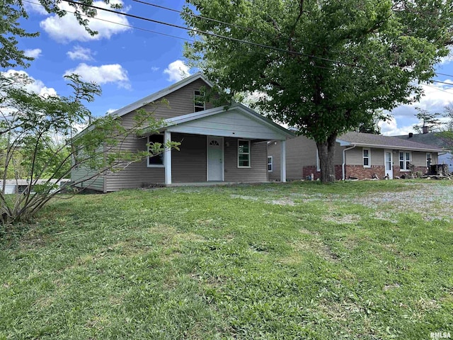 329 N Broadway Ave, Goreville, IL 62939 - view of front facade with a front yard and covered porch