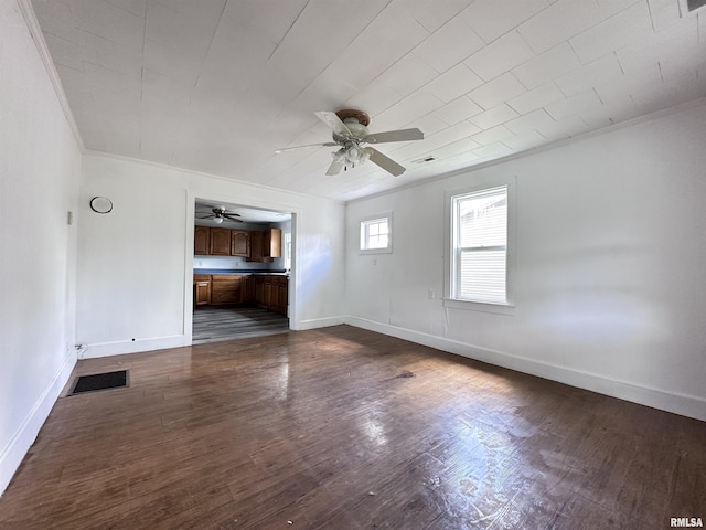 329 N Broadway Ave, Goreville, IL 62939 - spare room with ceiling fan, dark wood finished floors, baseboards, and crown molding