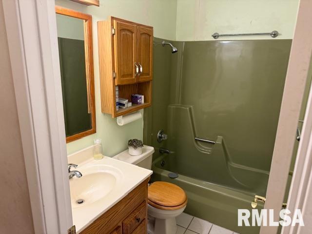 1700 W Taylor Dr, Carbondale, IL 62901 - bathroom with vanity, shower / washtub combination, toilet, and tile patterned flooring