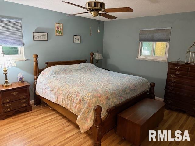 1700 W Taylor Dr, Carbondale, IL 62901 - bedroom featuring light wood-type flooring, baseboards, and ceiling fan