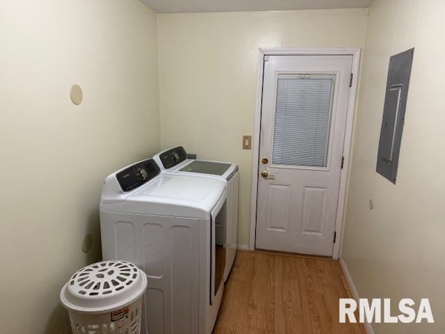 1700 W Taylor Dr, Carbondale, IL 62901 - laundry room with independent washer and dryer, electric panel, light wood-style flooring, and baseboards