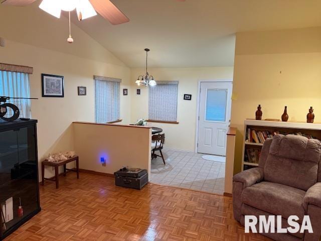 1700 W Taylor Dr, Carbondale, IL 62901 - living area with lofted ceiling, ceiling fan, a chandelier, and baseboards