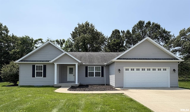 6005 Chandler Dr, Carterville, IL 62918 - ranch-style home with driveway, a front yard, a garage, and a porch