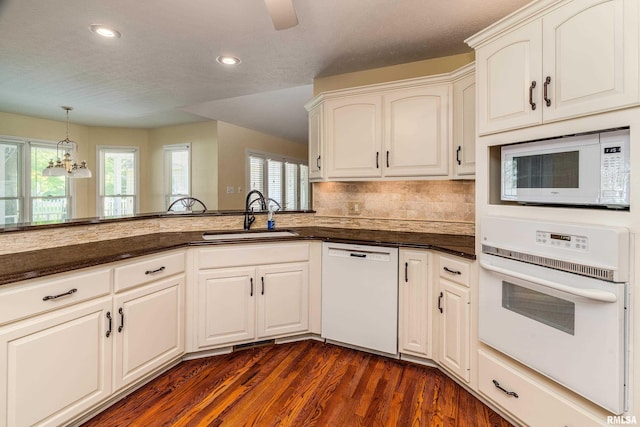 1803 N Dawn Dr, Marion, IL 62959 - kitchen featuring white appliances, plenty of natural light, dark wood-type flooring, a chandelier, and recessed lighting