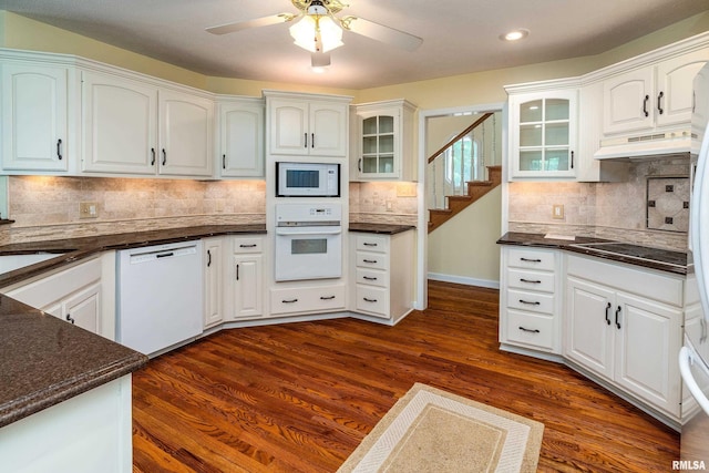 1803 N Dawn Dr, Marion, IL 62959 - kitchen featuring white appliances, under cabinet range hood, glass insert cabinets, a ceiling fan, and decorative backsplash