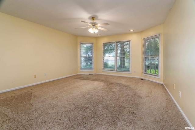 1803 N Dawn Dr, Marion, IL 62959 - empty room with plenty of natural light, a ceiling fan, carpet, and recessed lighting