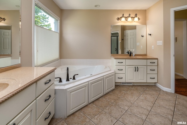 1803 N Dawn Dr, Marion, IL 62959 - bathroom with two vanities, a garden tub, and tile patterned flooring