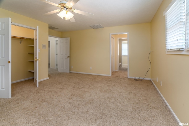 1803 N Dawn Dr, Marion, IL 62959 - unfurnished bedroom with carpet, a ceiling fan, and a walk in closet