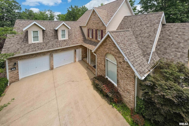 1803 N Dawn Dr, Marion, IL 62959 - view of front of home with brick siding, concrete driveway, roof with shingles, and a garage
