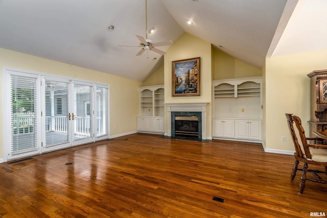 1803 N Dawn Dr, Marion, IL 62959 - unfurnished living room featuring ceiling fan, a high end fireplace, wood finished floors, high vaulted ceiling, and built in shelves