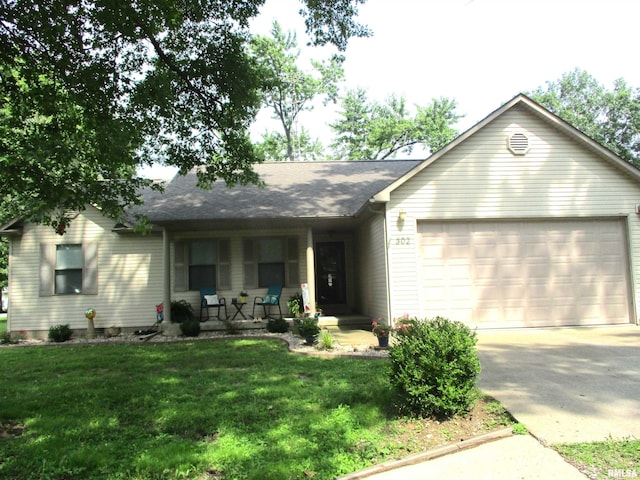 302 Elizabeth St, Benton, IL 62812 - ranch-style home with an attached garage, a front lawn, and covered porch
