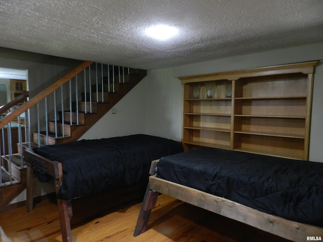 4370 Buncombe Rd, Vienna, IL 62995 - bedroom with wood finished floors and a textured ceiling