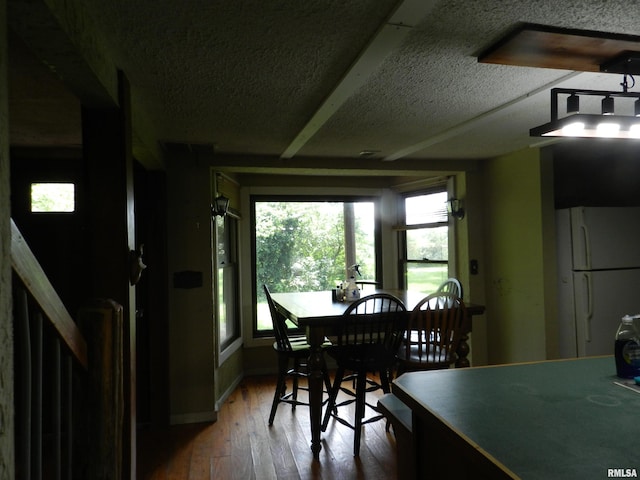 4370 Buncombe Rd, Vienna, IL 62995 - dining area featuring hardwood / wood-style flooring and a textured ceiling