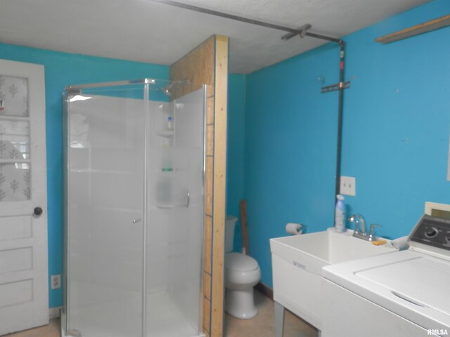4370 Buncombe Rd, Vienna, IL 62995 - full bathroom with washer / clothes dryer, a shower stall, and vanity