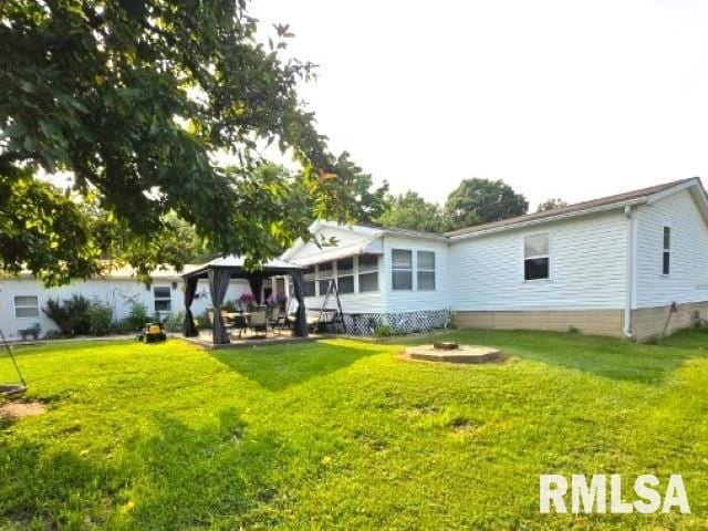 18802 E Fairfield Rd, Mount Vernon, IL 62864 - back of house with a gazebo and a lawn