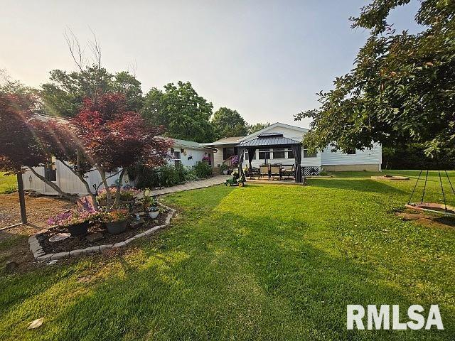 18802 E Fairfield Rd, Mount Vernon, IL 62864 - rear view of house with a gazebo, a lawn, and a patio area