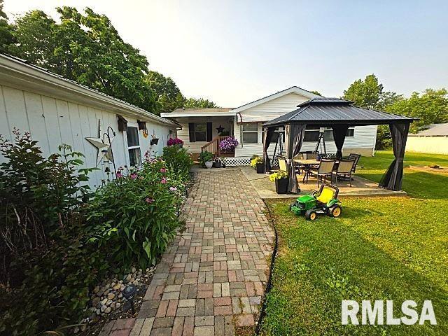 18802 E Fairfield Rd, Mount Vernon, IL 62864 - rear view of property featuring a gazebo, a yard, and a patio area