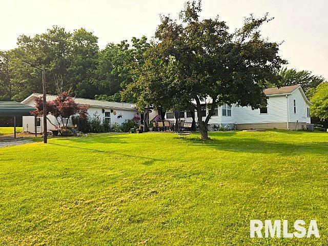 18802 E Fairfield Rd, Mount Vernon, IL 62864 - view of green lawn featuring a carport