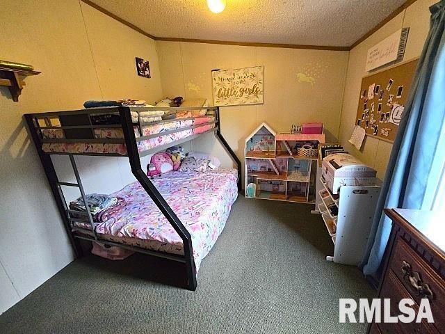 18802 E Fairfield Rd, Mount Vernon, IL 62864 - carpeted bedroom featuring a textured ceiling and ornamental molding