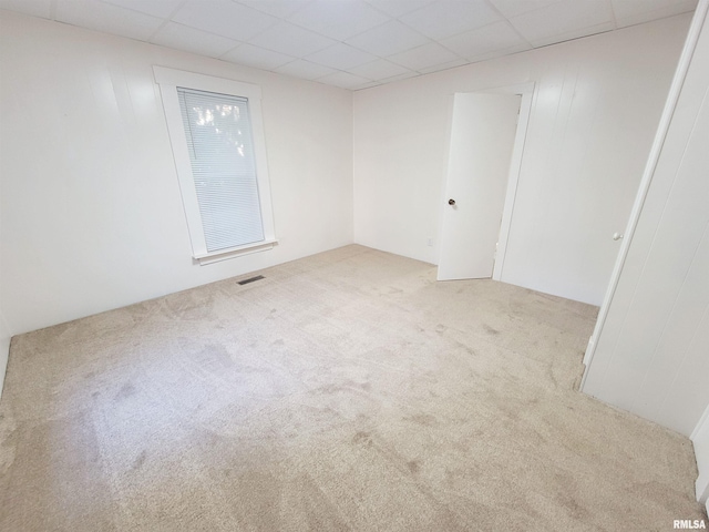 719 E Cherry St, Olney, IL 62450 - unfurnished room with carpet and a paneled ceiling