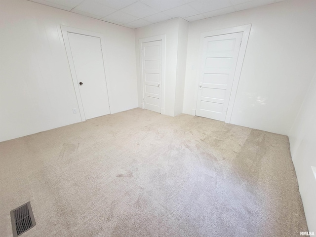 719 E Cherry St, Olney, IL 62450 - unfurnished bedroom with a paneled ceiling and carpet floors