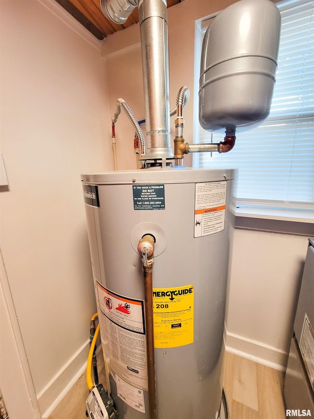719 E Cherry St, Olney, IL 62450 - utility room with water heater