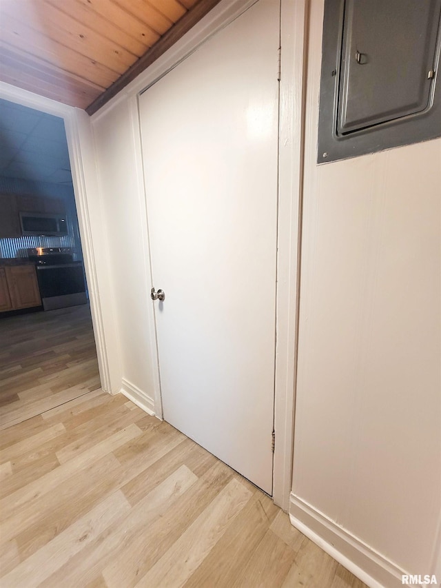 719 E Cherry St, Olney, IL 62450 - hall featuring light wood-type flooring, electric panel, and wooden ceiling