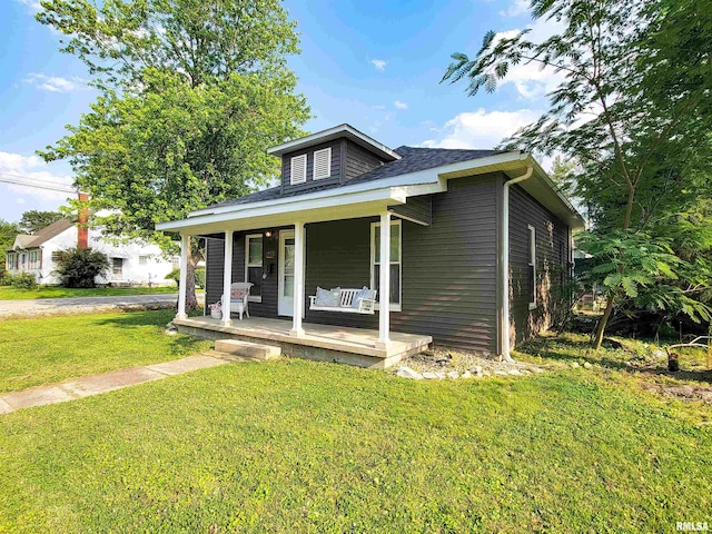 719 E Cherry St, Olney, IL 62450 - bungalow-style house featuring a porch and a front yard