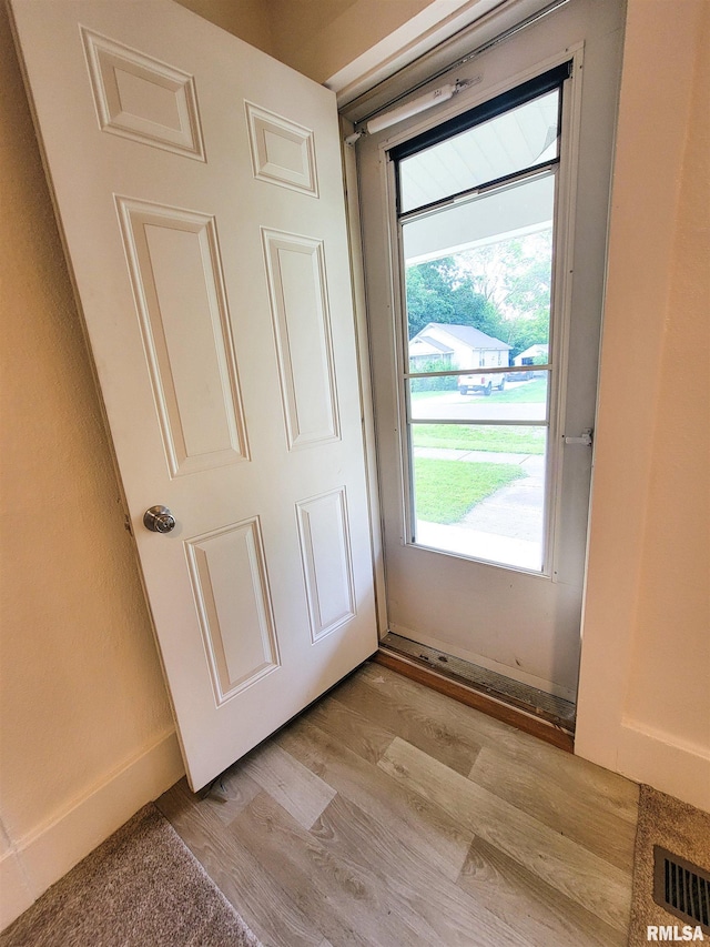 719 E Cherry St, Olney, IL 62450 - doorway to outside with light wood-style flooring