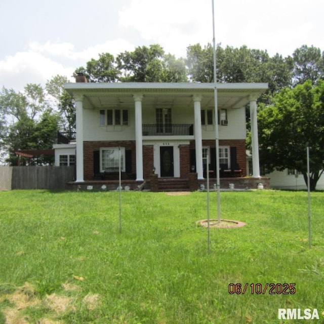 632 N Pershing St, Energy, IL 62933 - back of property with brick siding, covered porch, and a chimney