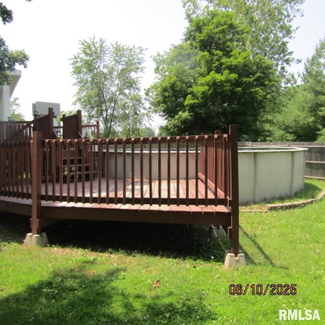 632 N Pershing St, Energy, IL 62933 - deck featuring an outdoor pool and a lawn