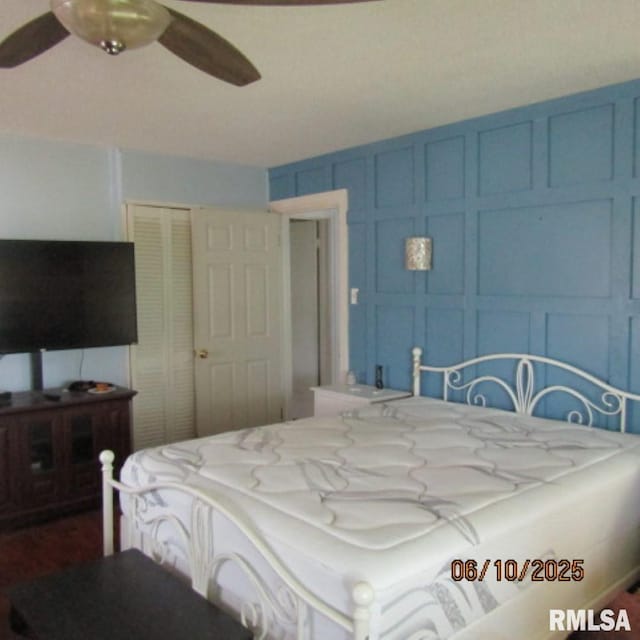 632 N Pershing St, Energy, IL 62933 - bedroom with a closet, a decorative wall, and a ceiling fan