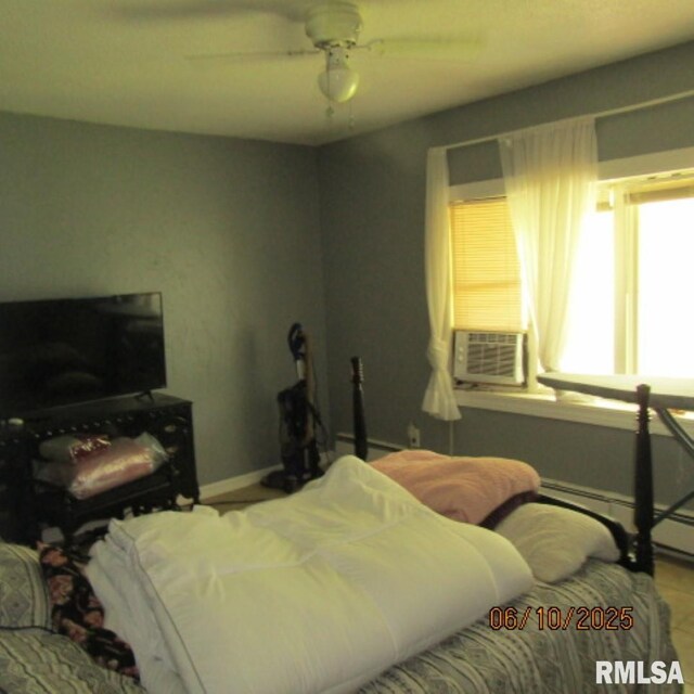 632 N Pershing St, Energy, IL 62933 - bedroom featuring cooling unit, a ceiling fan, and a baseboard heating unit