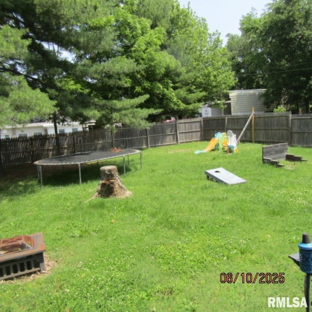 632 N Pershing St, Energy, IL 62933 - fenced backyard with a trampoline