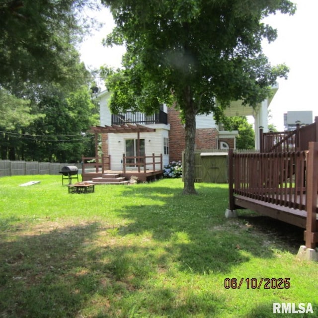 632 N Pershing St, Energy, IL 62933 - view of yard featuring a deck and a storage unit
