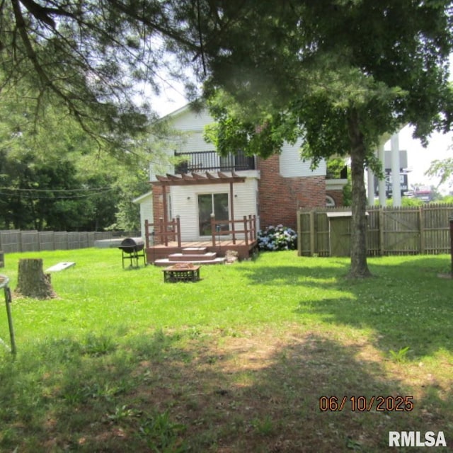 632 N Pershing St, Energy, IL 62933 - back of house with a fire pit, a pergola, and a wooden deck