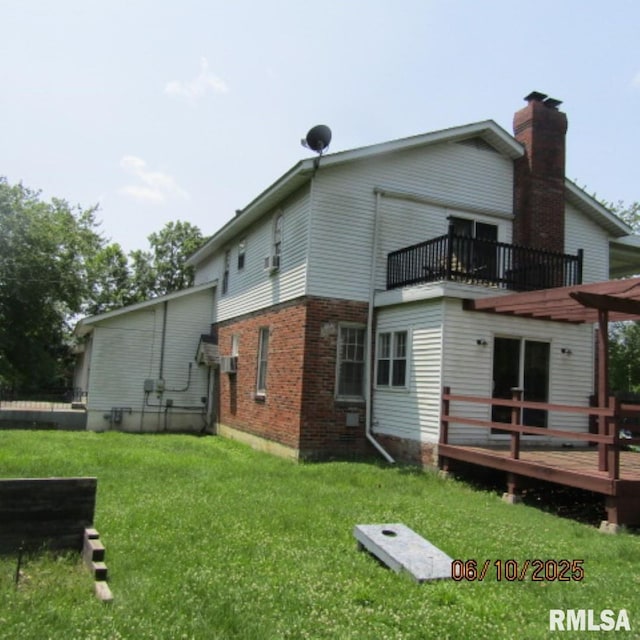 632 N Pershing St, Energy, IL 62933 - rear view of property with a balcony, a yard, a deck, and brick siding