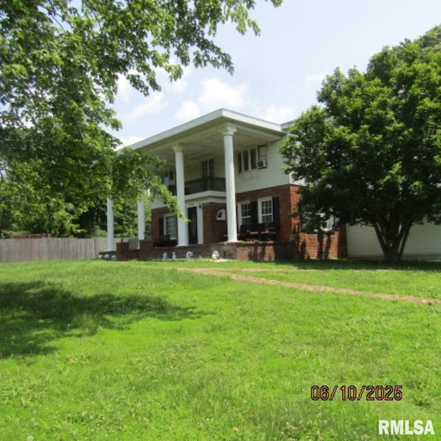 632 N Pershing St, Energy, IL 62933 - neoclassical home featuring brick siding and a balcony